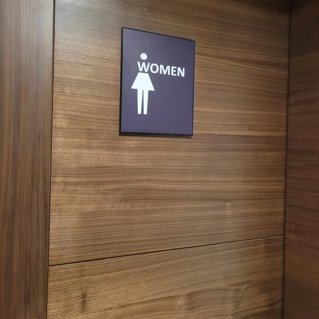 women restroom name plate sign