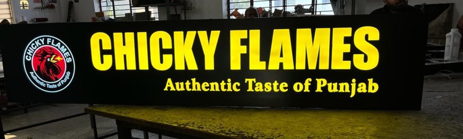 chicken flames restaurant sign board